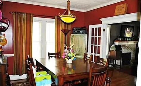 a view of a dining room with furniture and window