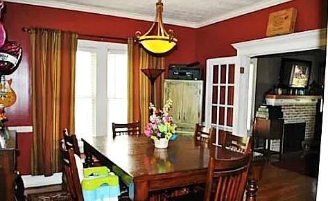 a view of a dining room with furniture and window