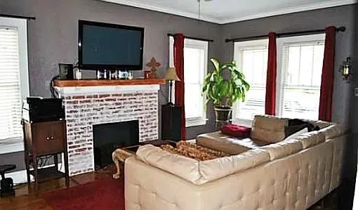 a living room with furniture and a fireplace