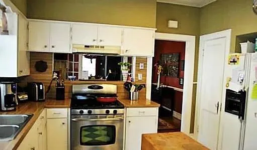 a kitchen with a stove and a refrigerator