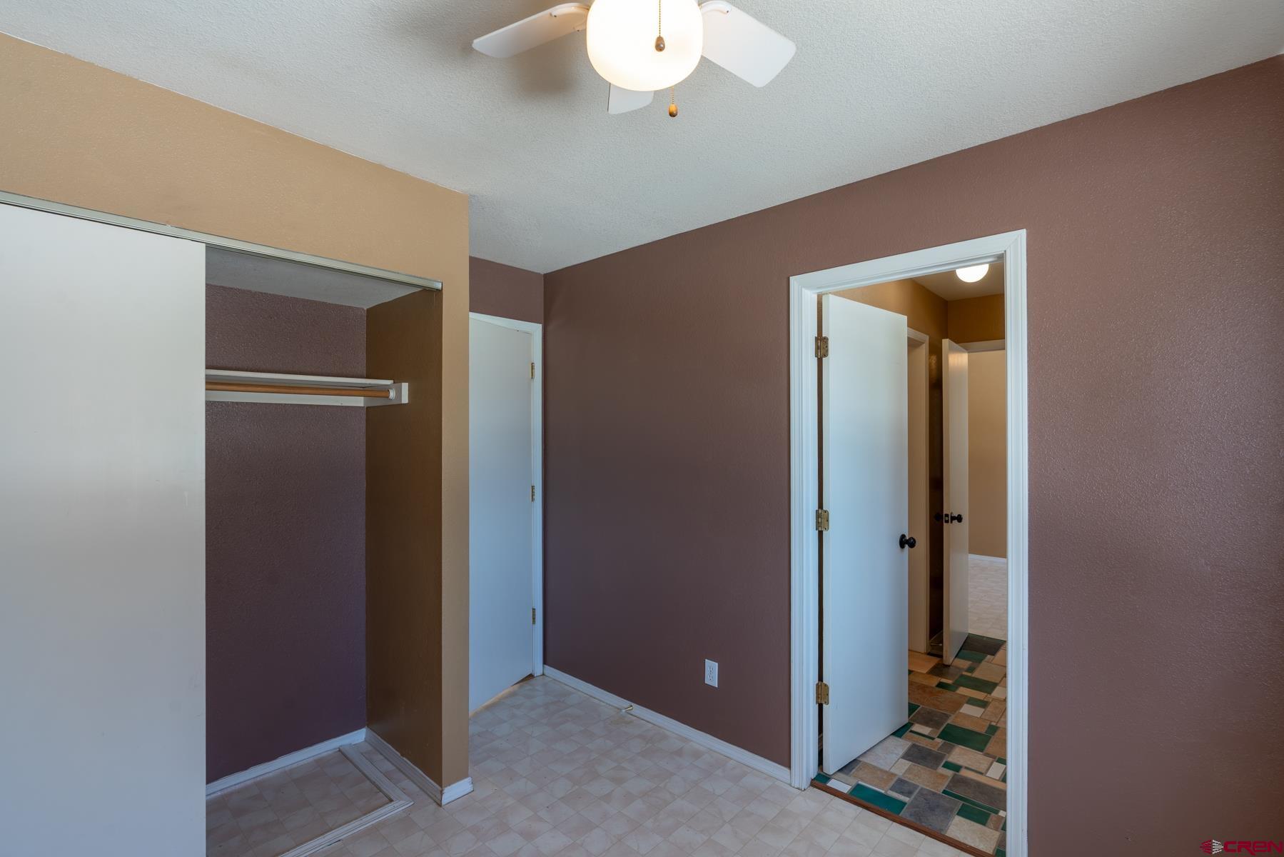 190 Pine Ridge Road Durango, CO 81301 - Photo 15 of 27 an empty room with closet and a bathroom