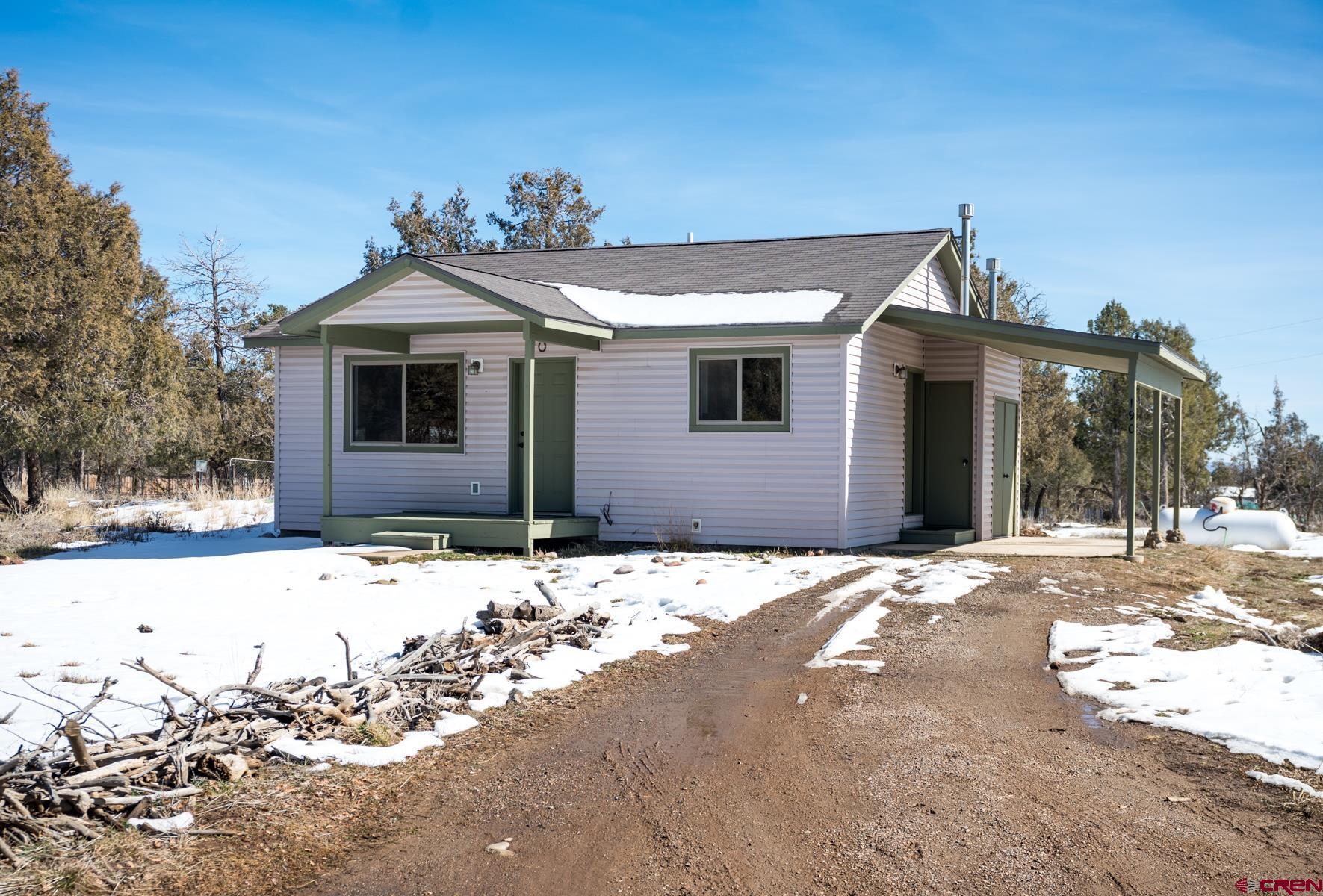 190 Pine Ridge Road Durango, CO 81301 - Photo 2 of 27 a front view of a house