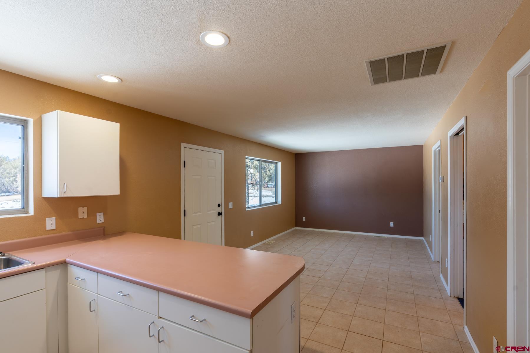 190 Pine Ridge Road Durango, CO 81301 - Photo 4 of 27 a kitchen with a sink and cabinets