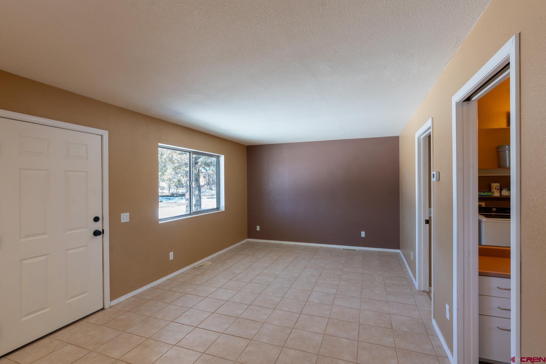 190 Pine Ridge Road Durango, CO 81301 - Photo 5 of 27 a view of an empty room with window and closet area