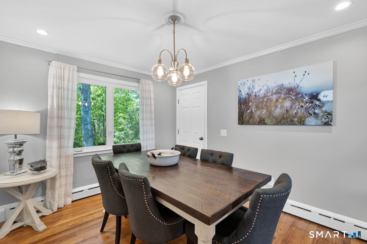 1013 Ratley Road Suffield, CT 06093 - Photo 13 of 39 a view of a dining room with furniture window and outside view