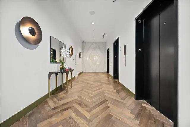 a bed sitting in a bedroom next to a blue wall