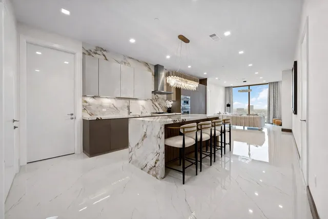 a kitchen with a table and chairs in it