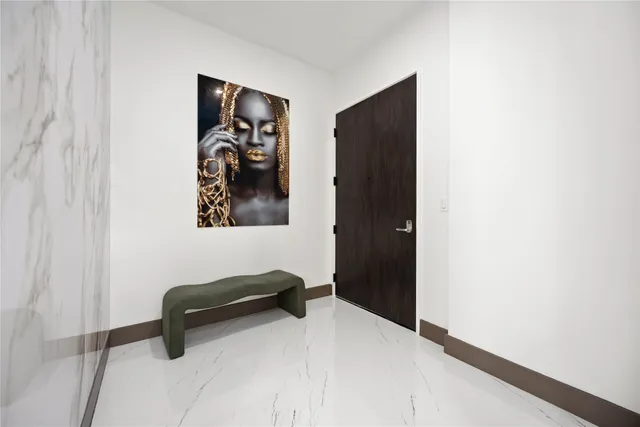 a kitchen with stainless steel appliances kitchen island granite countertop a refrigerator and a stove top oven