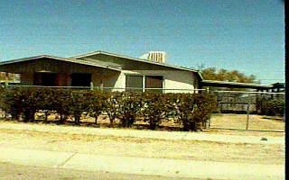 1127 East 27th Street Tucson, AZ 85713 - Photo 1 of 1 a front view of a house with a yard
