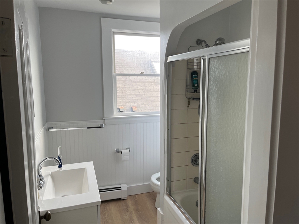 126 Pleasant Street, Unit 3 Marblehead, MA 01945 - Photo 6 of 7 a bathroom with a bathtub and a shower