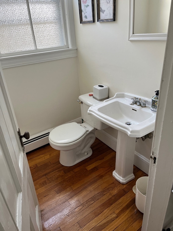 126 Pleasant Street, Unit 3 Marblehead, MA 01945 - Photo 7 of 7 a white toilet sitting next to a bathroom sink