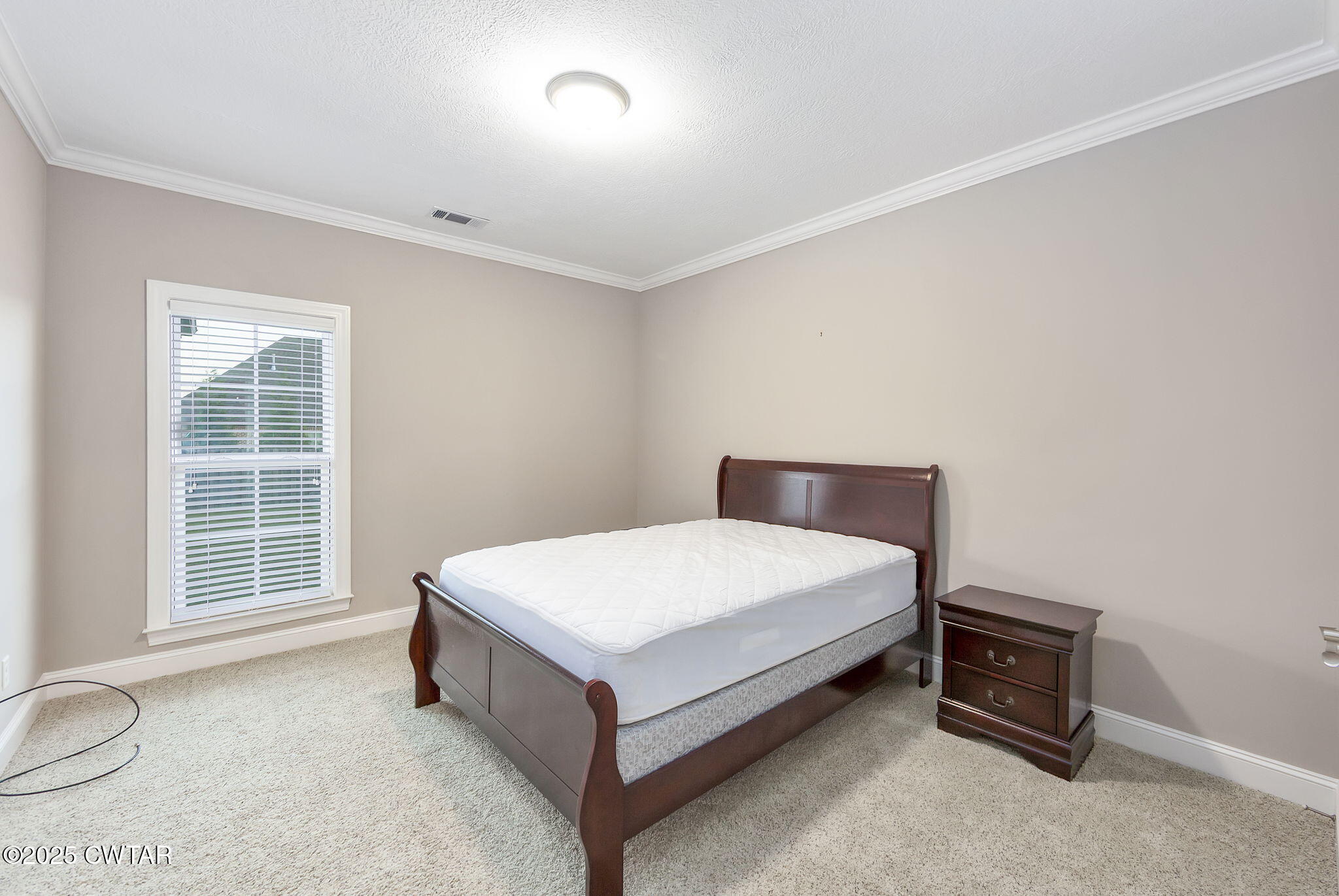 92 Samuel Drive Jackson, TN 38305 - Photo 18 of 23 a room with a bed and a window