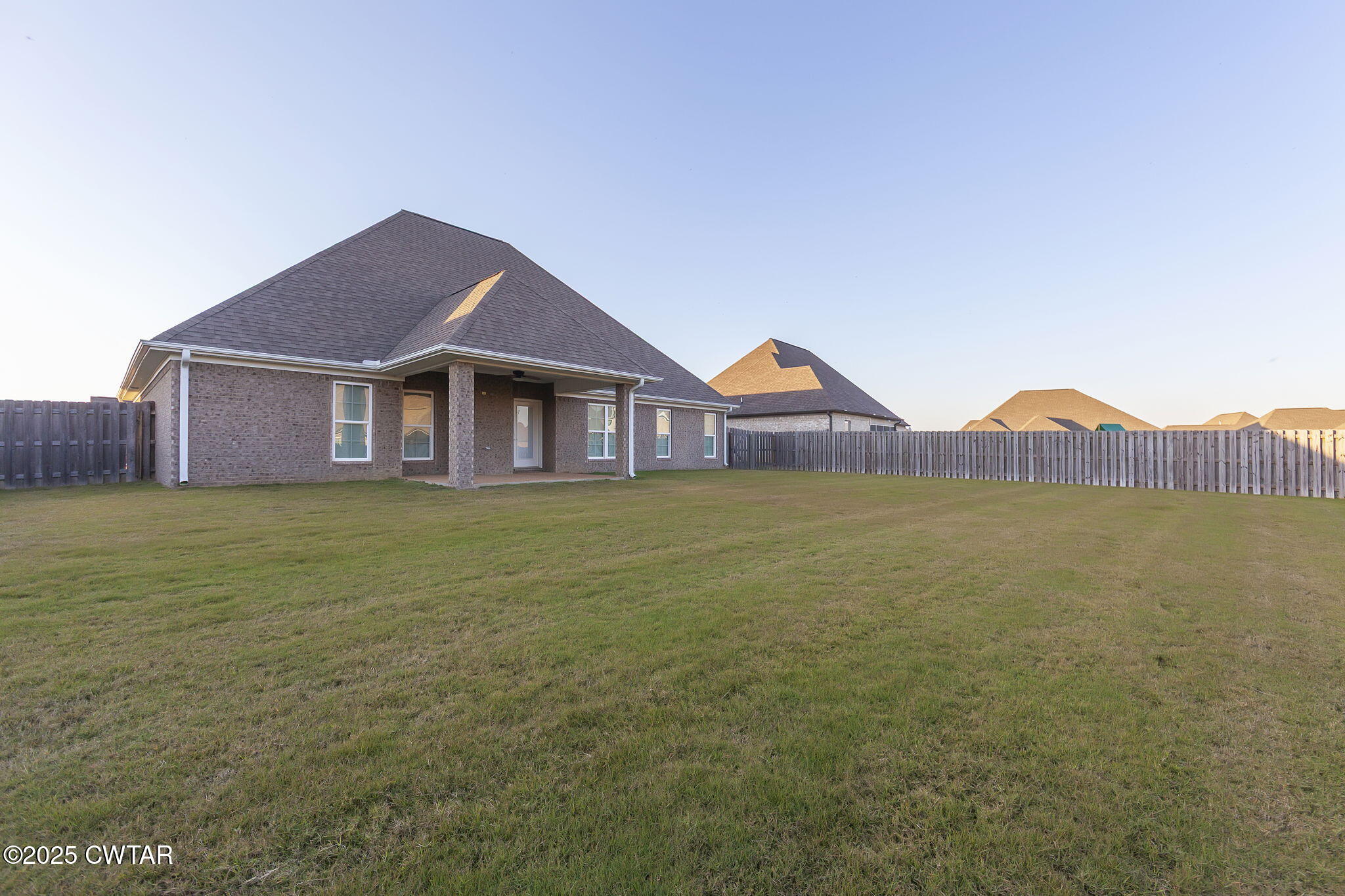92 Samuel Drive Jackson, TN 38305 - Photo 23 of 23 a house with a garden in front of it
