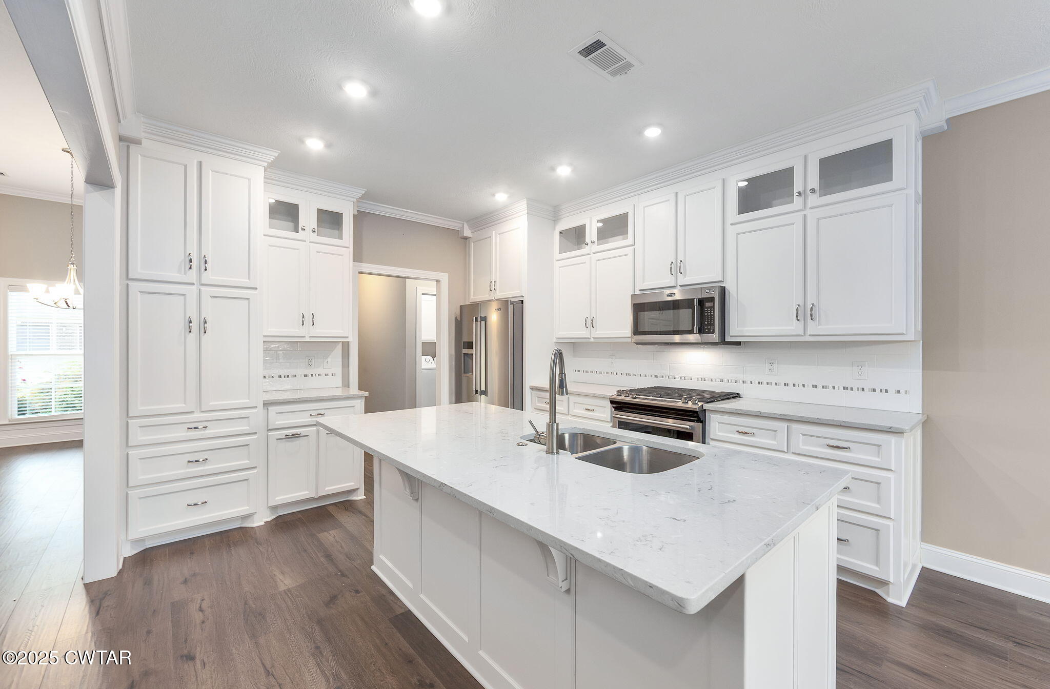 92 Samuel Drive Jackson, TN 38305 - Photo 6 of 23 a kitchen with stainless steel appliances a stove sink and refrigerator