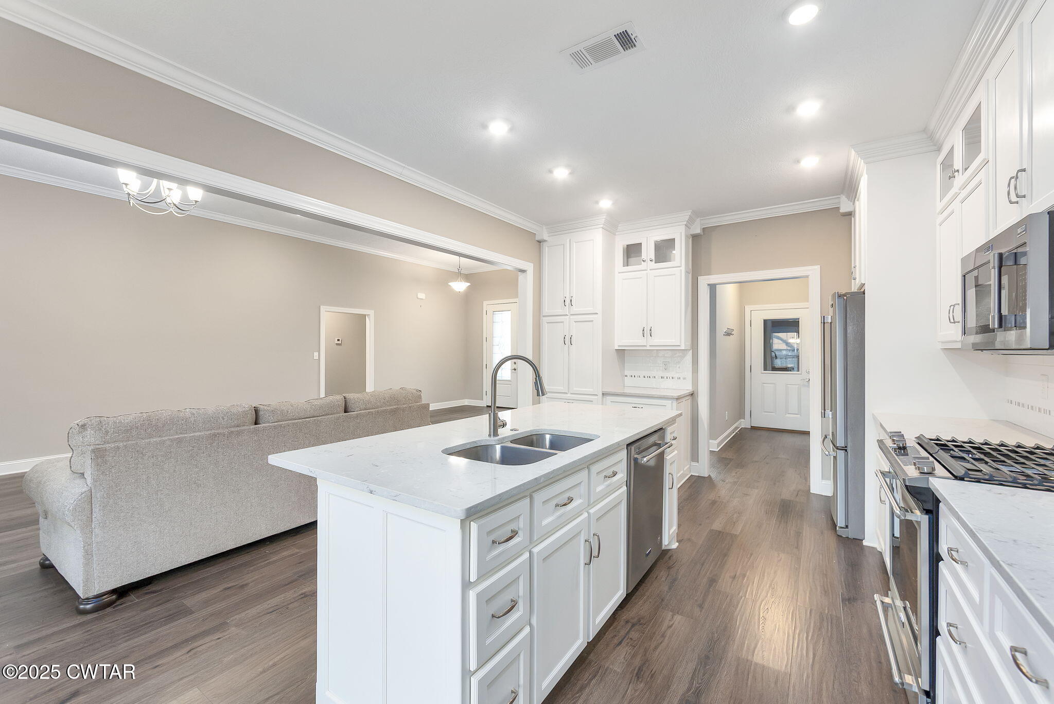 92 Samuel Drive Jackson, TN 38305 - Photo 8 of 23 a kitchen with sink stove and refrigerator