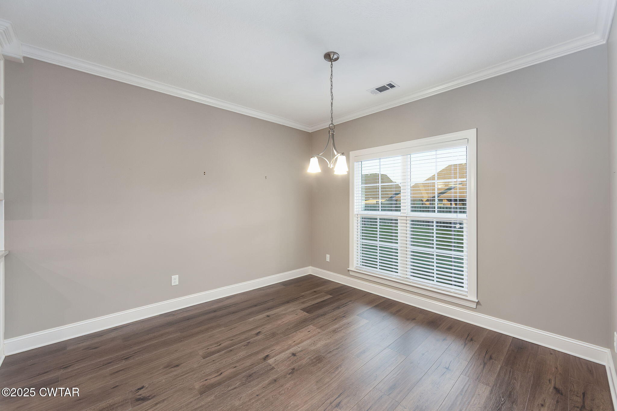 92 Samuel Drive Jackson, TN 38305 - Photo 10 of 23 a view of wooden floor and a chandelier in a room
