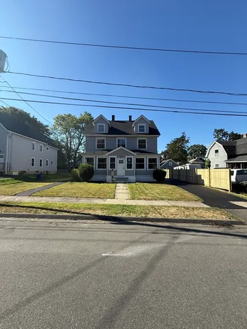 a view of a swimming pool with a car parked in front of it