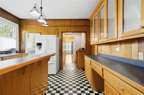 a kitchen with stainless steel appliances a sink and cabinets
