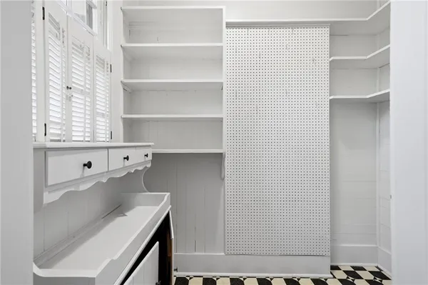 a view of a room with shelf on the wall