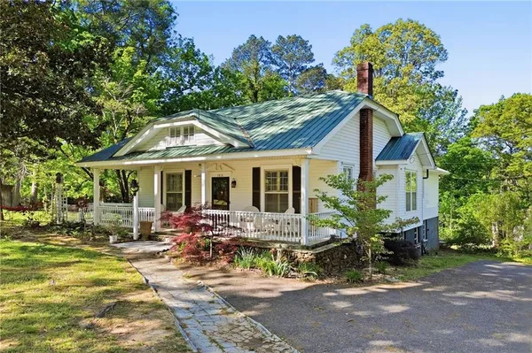a front view of house with yard outdoor seating and entertaining space