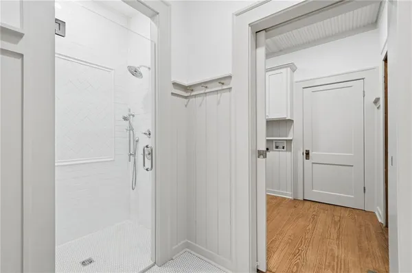 a view of a bathroom with a shower and a sink