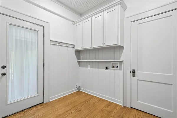 a view of an empty room with closet area
