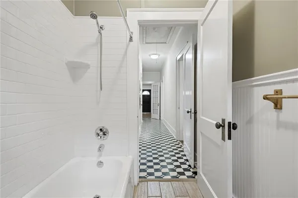a bathroom with a bathtub and shower