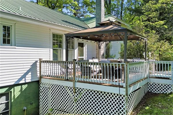 a view of a wooden deck and a yard