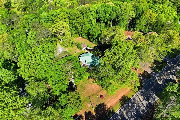 a backyard of a house with lots of green space