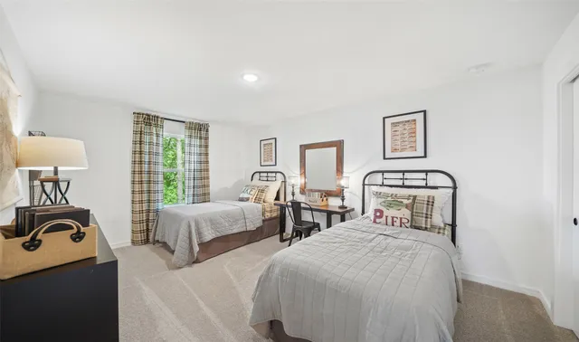 a bathroom with a sink a toilet and a shower