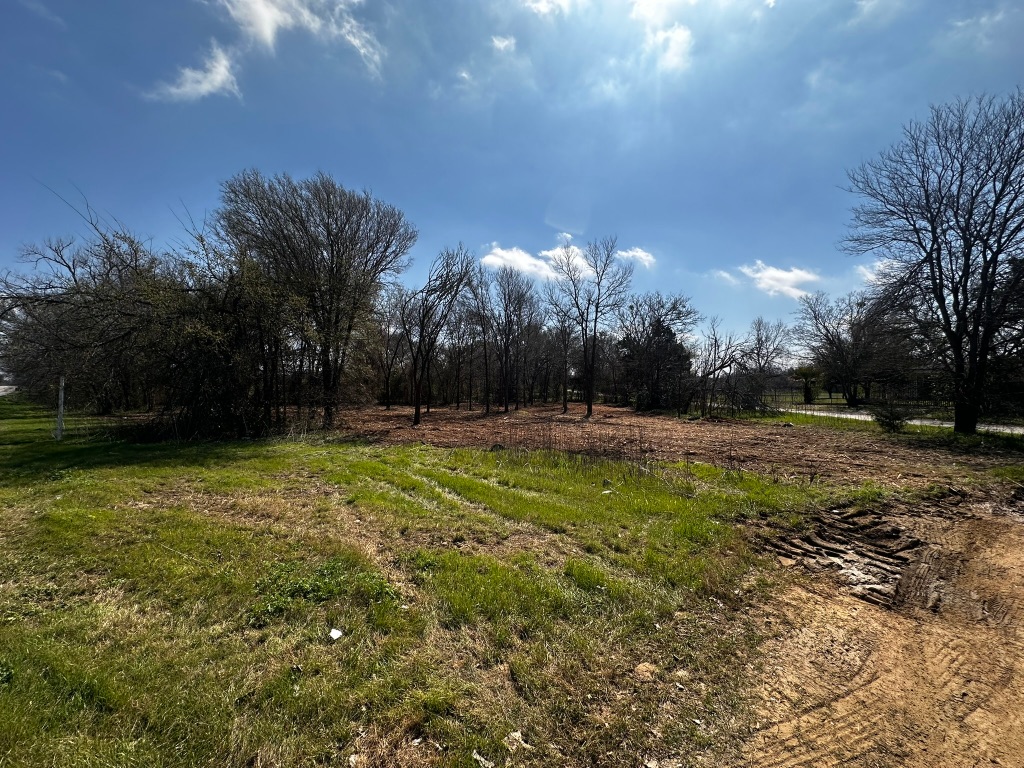 0 East 2nd Street Elgin, TX 78621 - Photo 1 of 24 a view of outdoor space with deck and yard