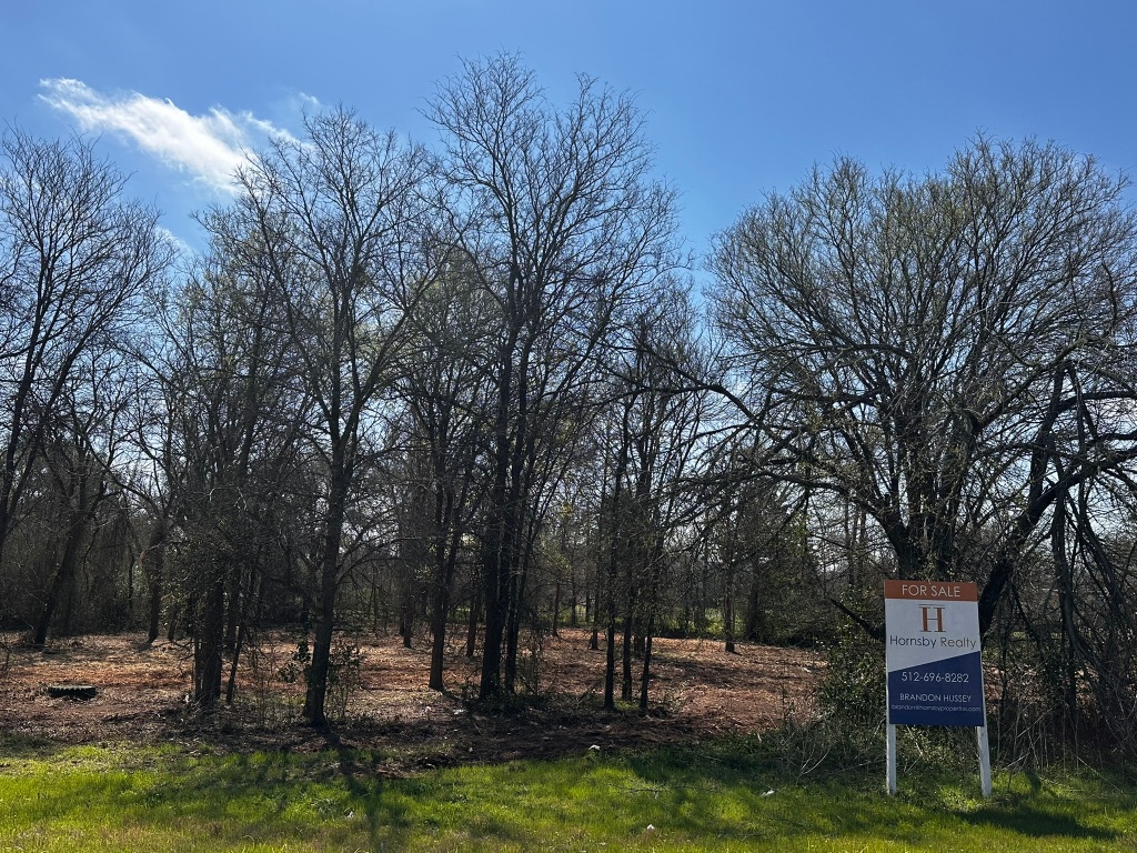 0 East 2nd Street Elgin, TX 78621 - Photo 8 of 24 a view of a house with a yard and tree s