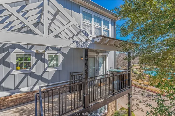 a view of a house with iron fence