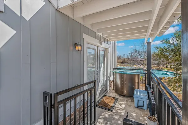 a view of a balcony and furniture