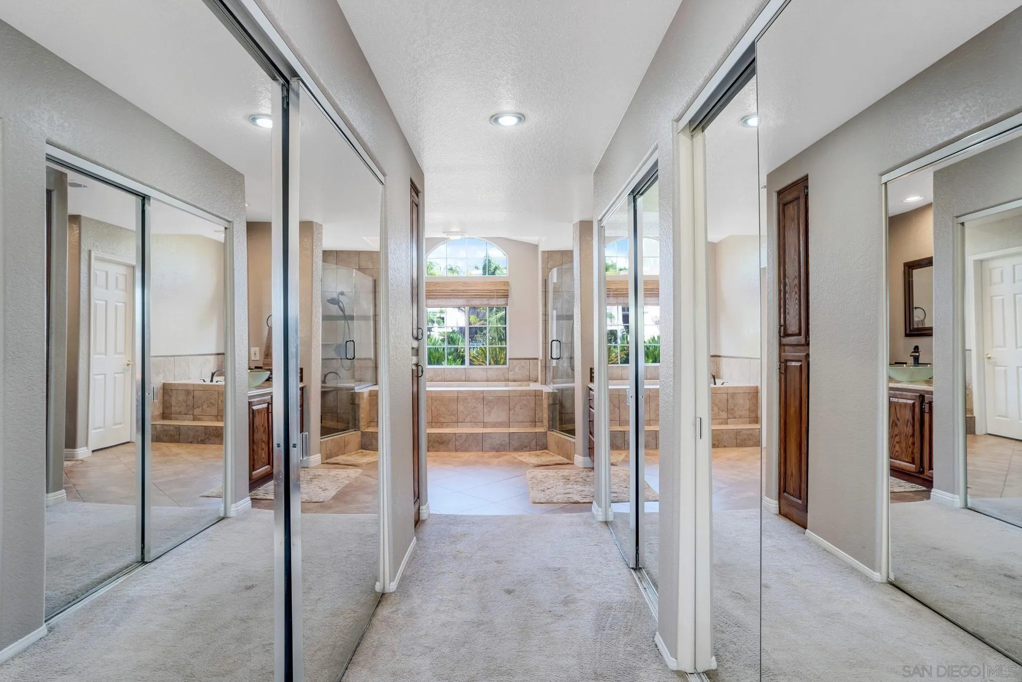 1372 Graham Place Escondido, CA 92026 - Photo 11 of 63 a bathroom with a glass shower door and a glass door