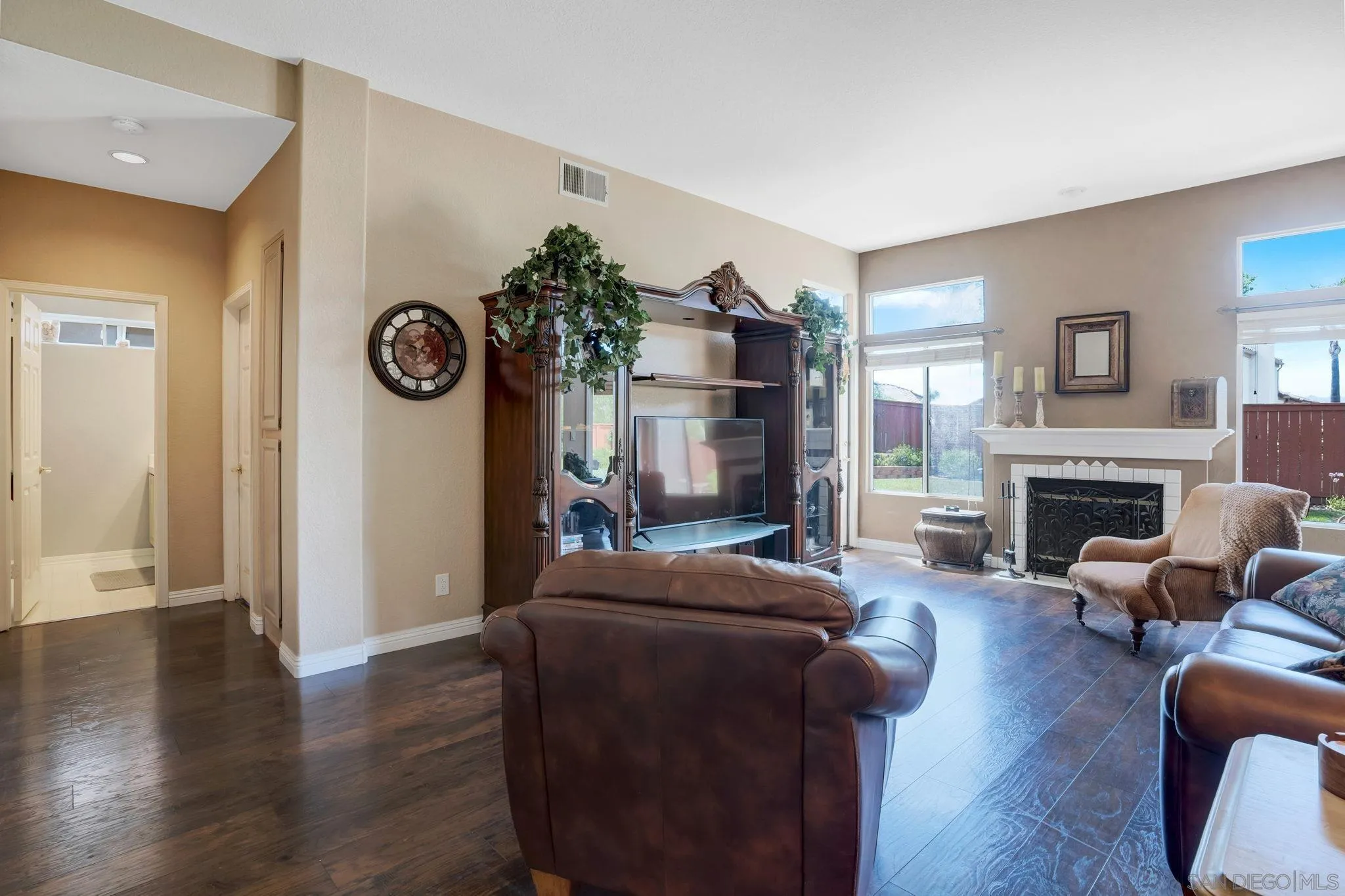 1372 Graham Place Escondido, CA 92026 - Photo 14 of 63 a living room with furniture a fireplace and a window