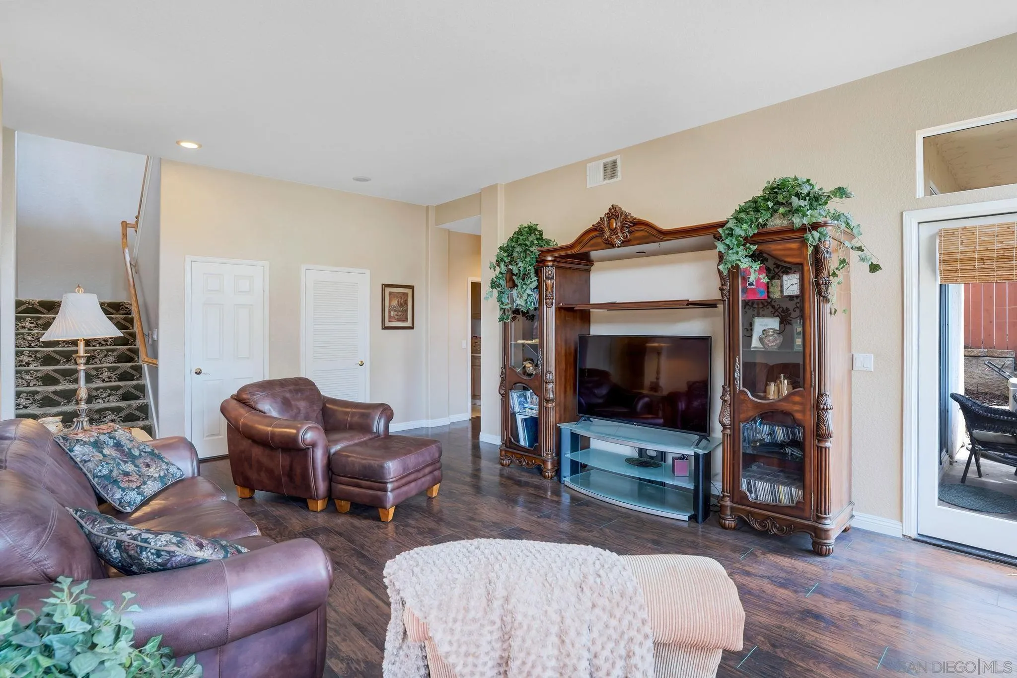 1372 Graham Place Escondido, CA 92026 - Photo 16 of 63 a living room with furniture a flat screen tv and a fireplace
