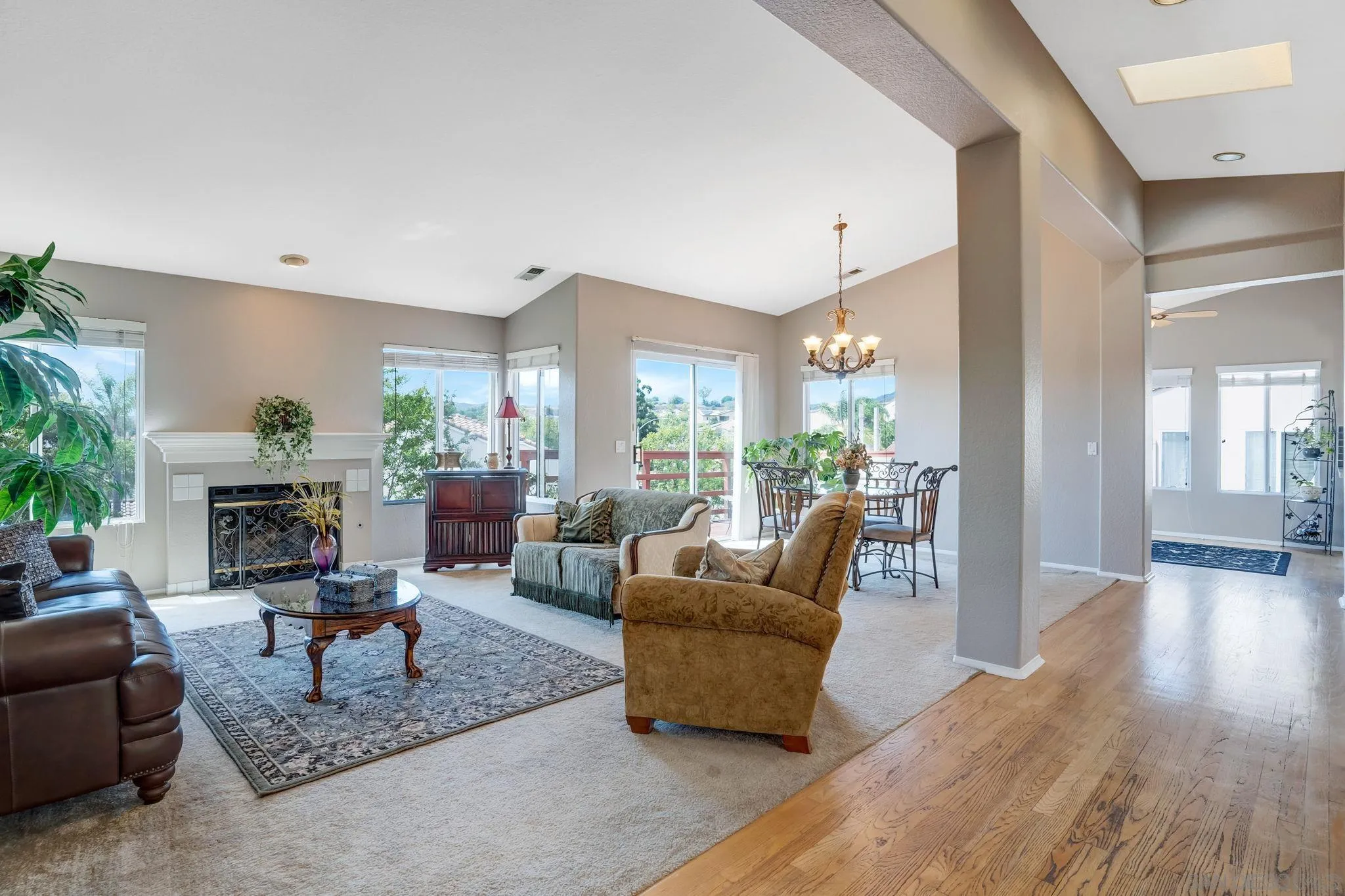 1372 Graham Place Escondido, CA 92026 - Photo 23 of 63 a living room with furniture dining area and a fireplace