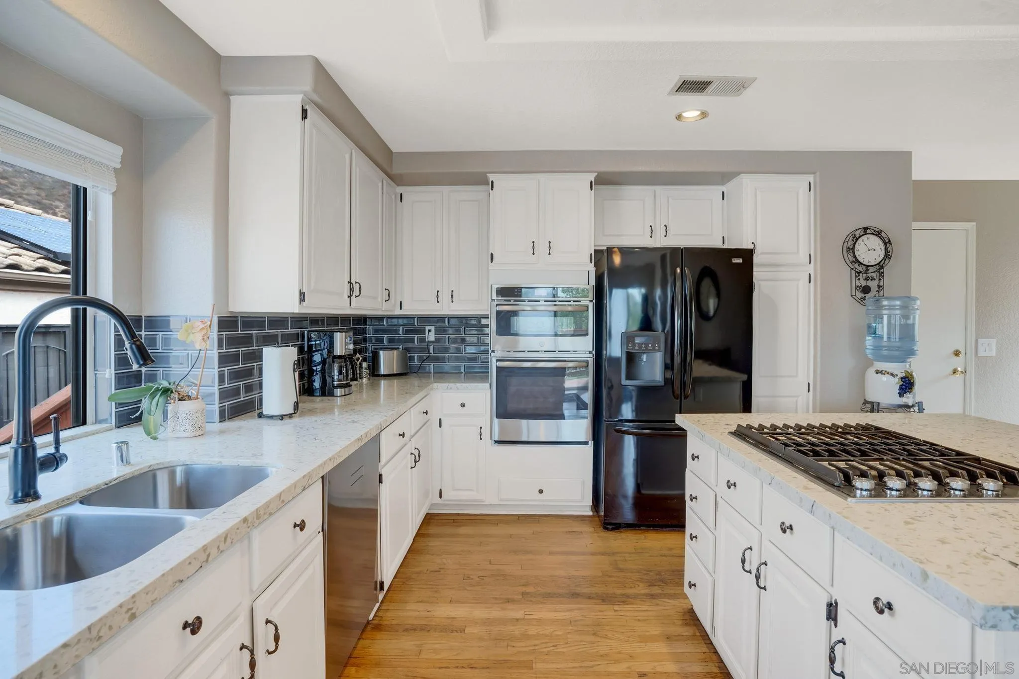 1372 Graham Place Escondido, CA 92026 - Photo 29 of 63 a kitchen with refrigerator and cabinets