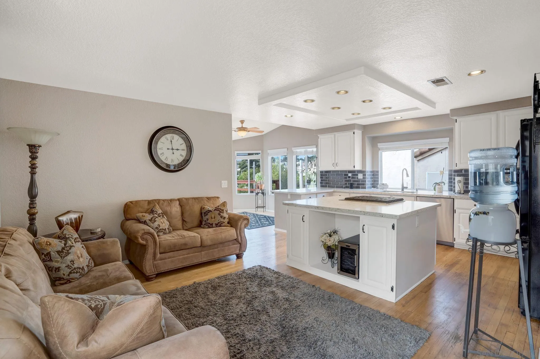 1372 Graham Place Escondido, CA 92026 - Photo 33 of 63 a living room with a couch and a clock