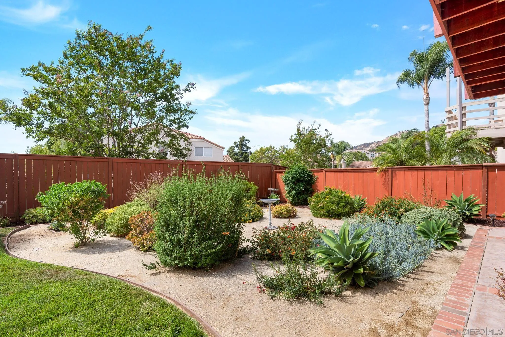 1372 Graham Place Escondido, CA 92026 - Photo 44 of 63 a view of a garden with plants and a bench