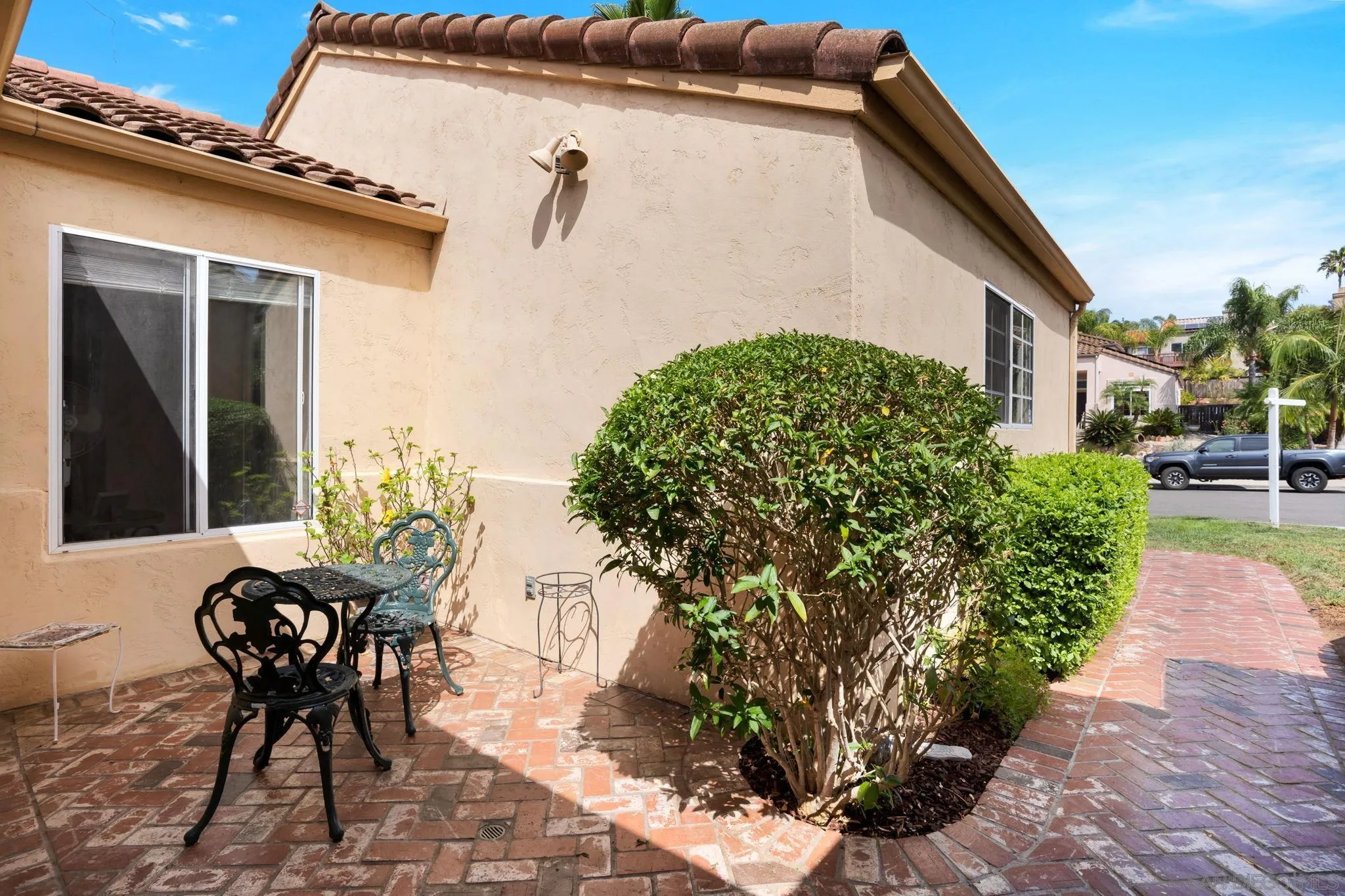 1372 Graham Place Escondido, CA 92026 - Photo 50 of 63 a patio with table and chairs and potted plants
