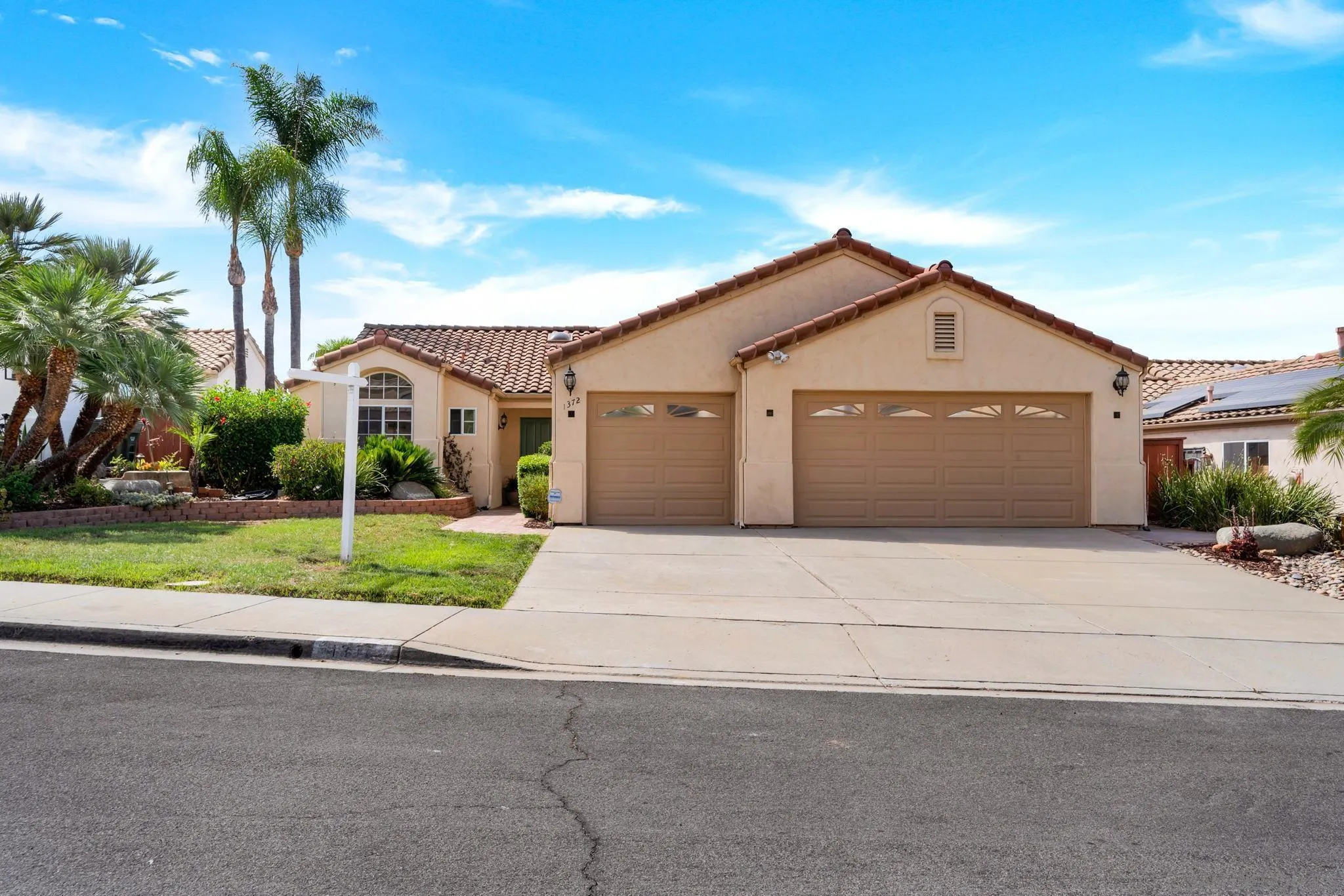 1372 Graham Place Escondido, CA 92026 - Photo 52 of 63 a front view of a house with a yard and garage