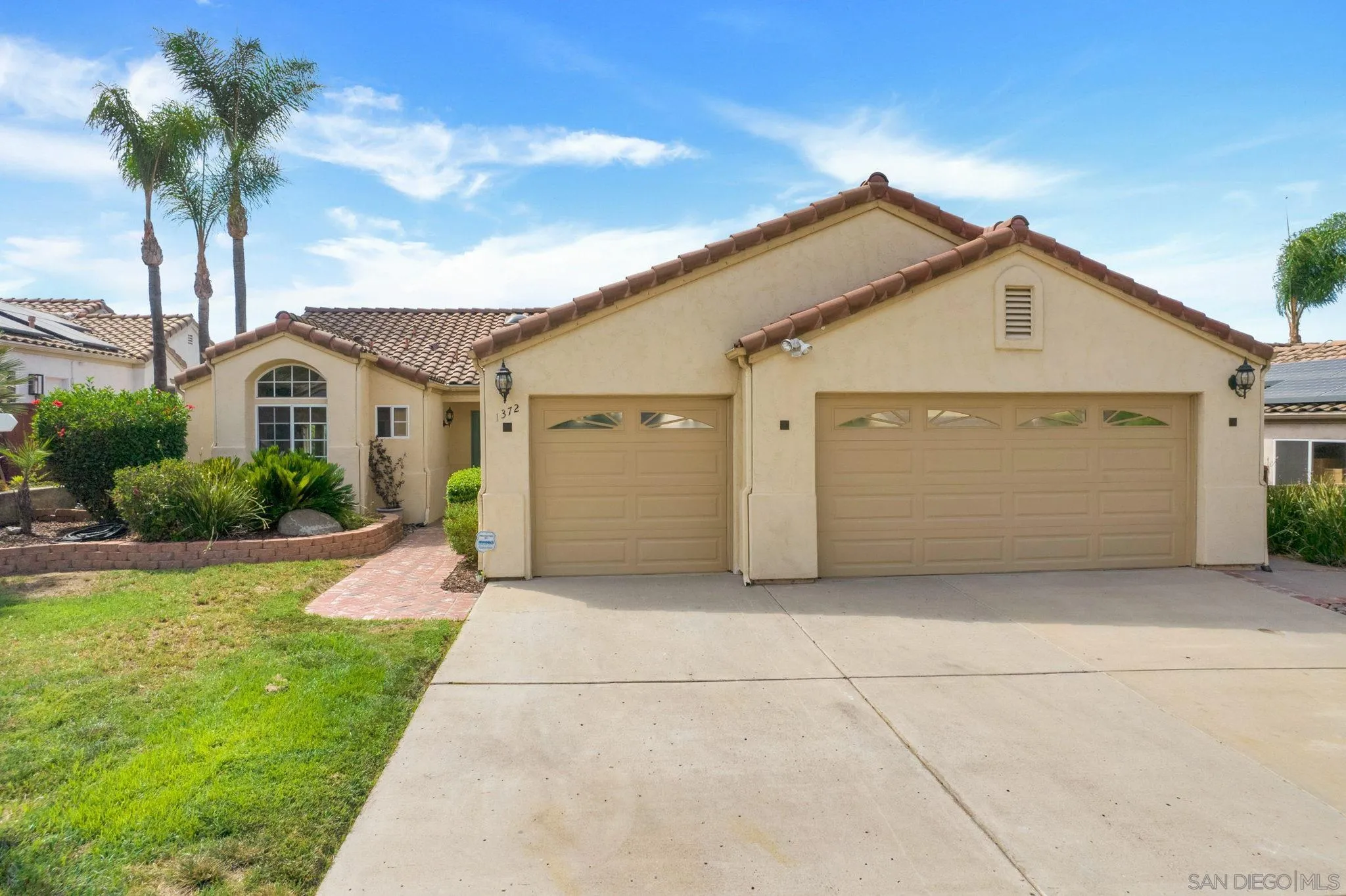 1372 Graham Place Escondido, CA 92026 - Photo 53 of 63 a front view of a house with a yard and garage