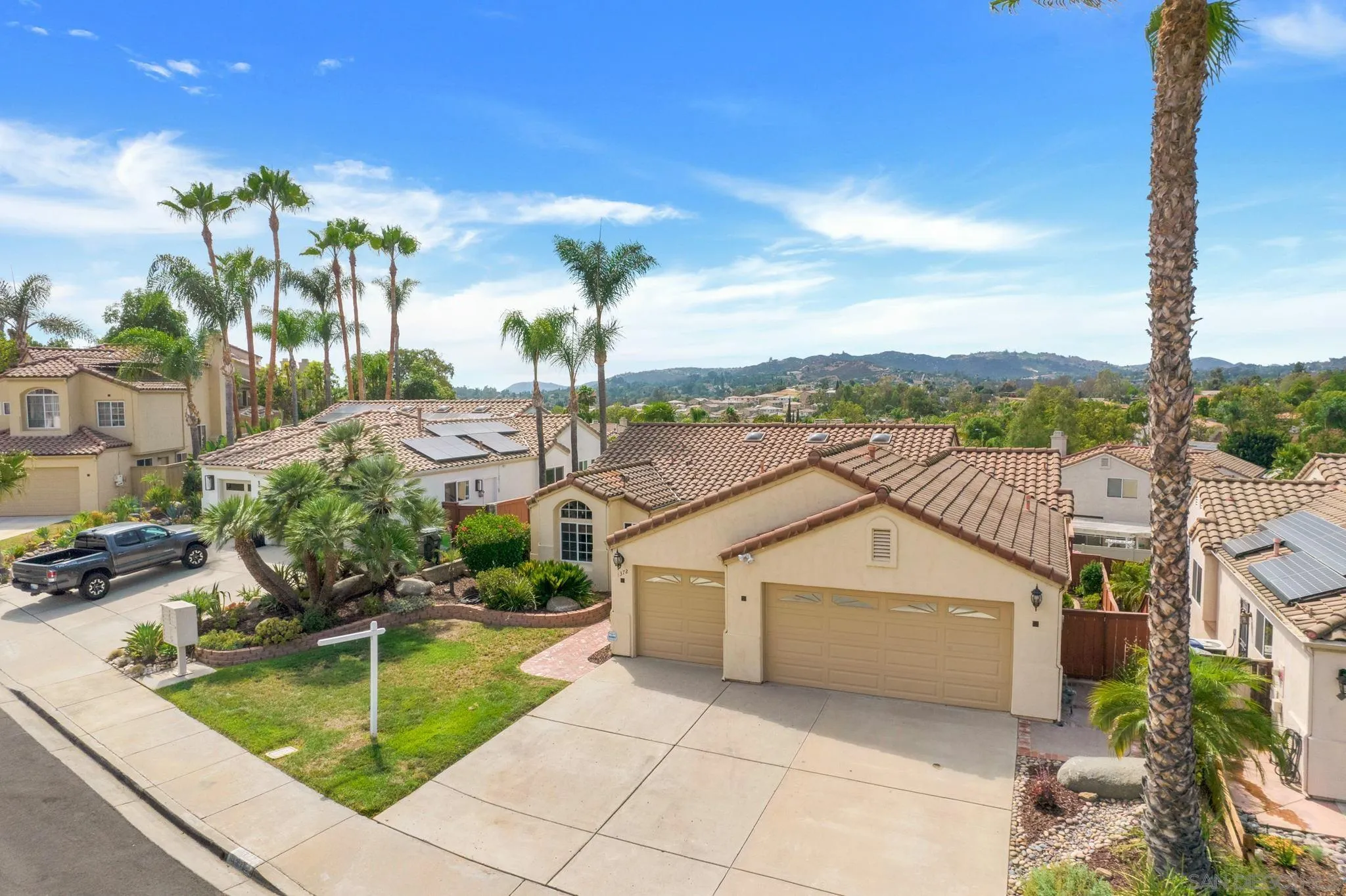 1372 Graham Place Escondido, CA 92026 - Photo 54 of 63 a view of a house with a patio and a garden