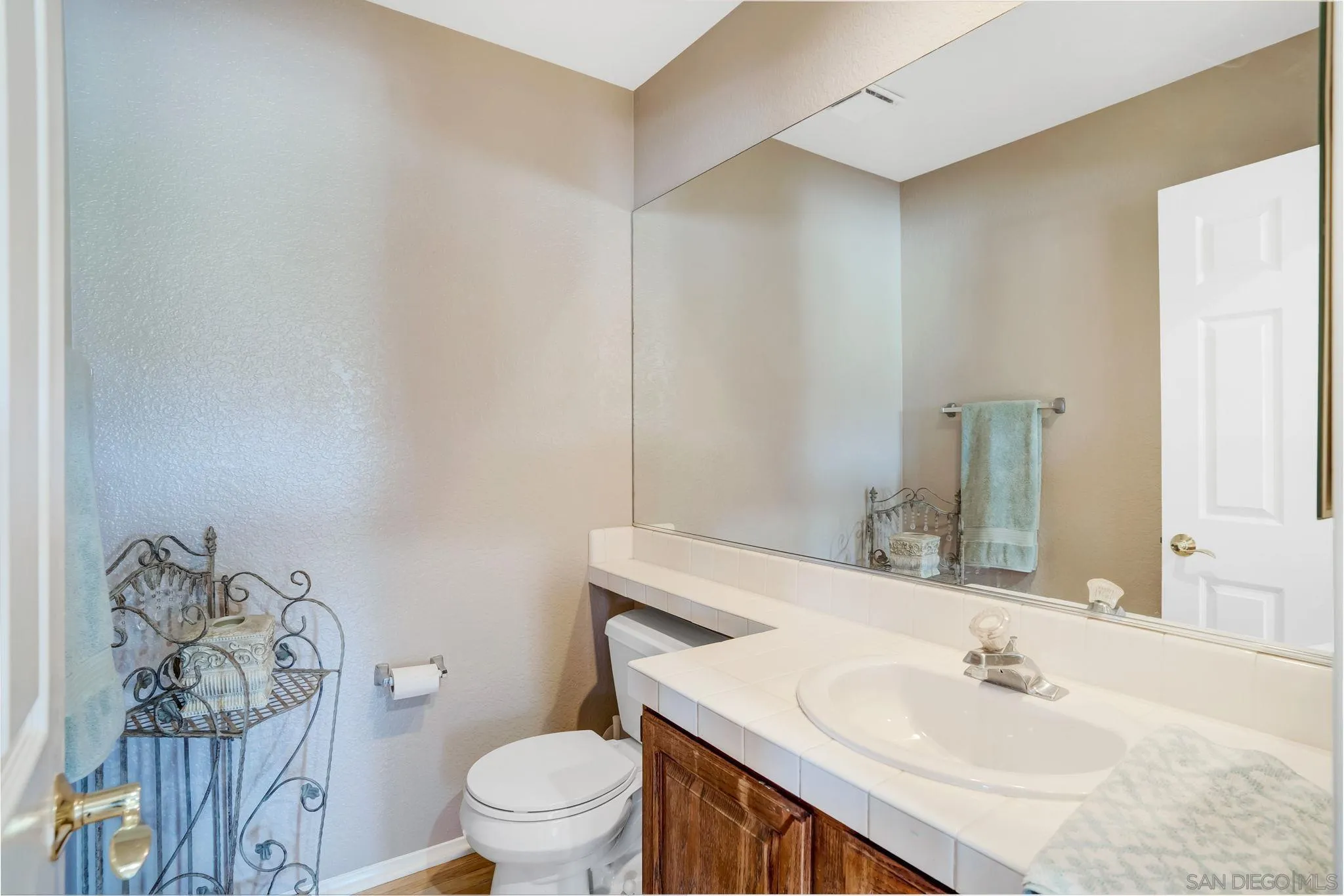 1372 Graham Place Escondido, CA 92026 - Photo 8 of 63 a bathroom with a sink and a mirror