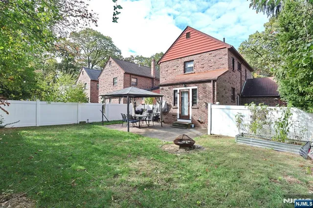 a house view with a sitting space and garden space