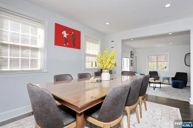 a view of a dining room with furniture and window