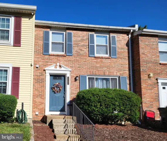 a front view of a house with outdoor space