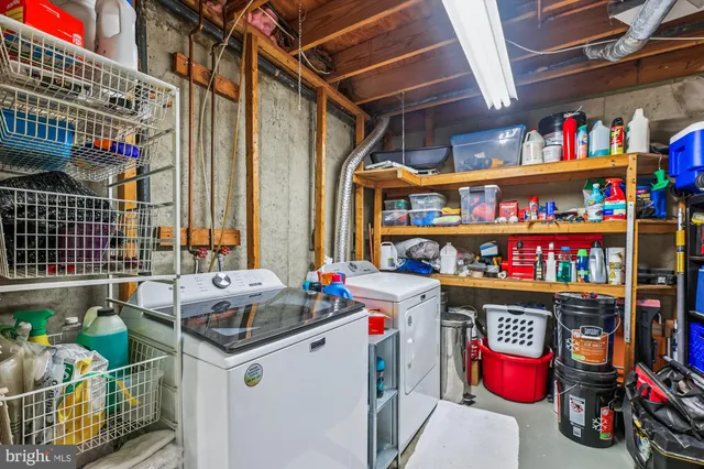 a store room with lots of furniture and clutter